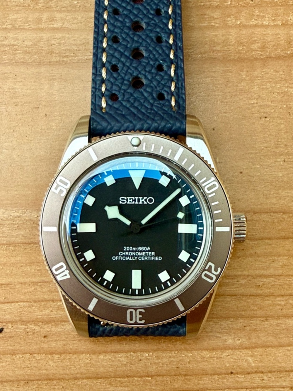 Seiko Black Dial Watch with Blue Strap and Bronze Bezel
